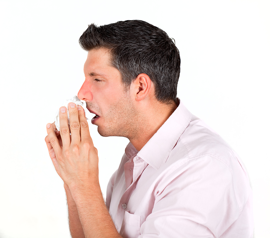 Мужчина чихает. Tissue sneezing man.